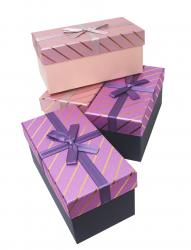 Набор из четырёх прямоугольных подарочных коробочек разного цвета, отделка фактурной блестящей бумагой, размер 21*10,5*9,5 см.